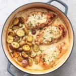 chicken and potatoes with cream sauce in skillet overhead