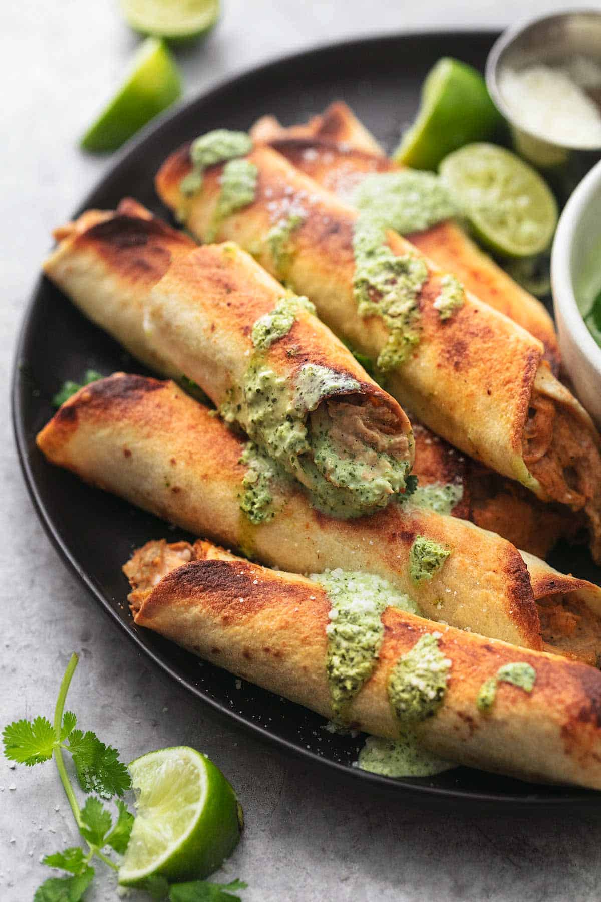 close up of instant pot chicken taquitos on a plate.