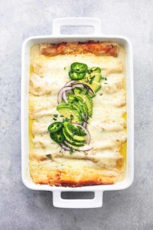 overhead white chicken enchiladas in white pan