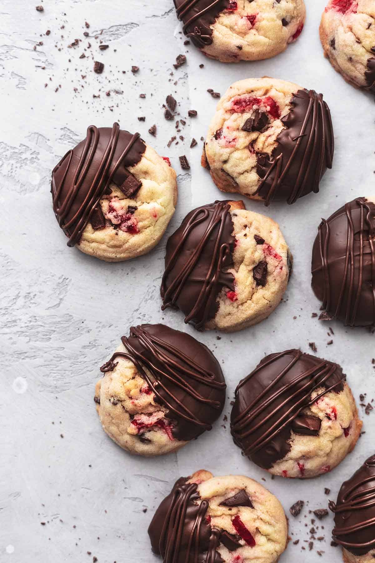 overhead chocolate dipped cookies with cherry and chocolate chunks