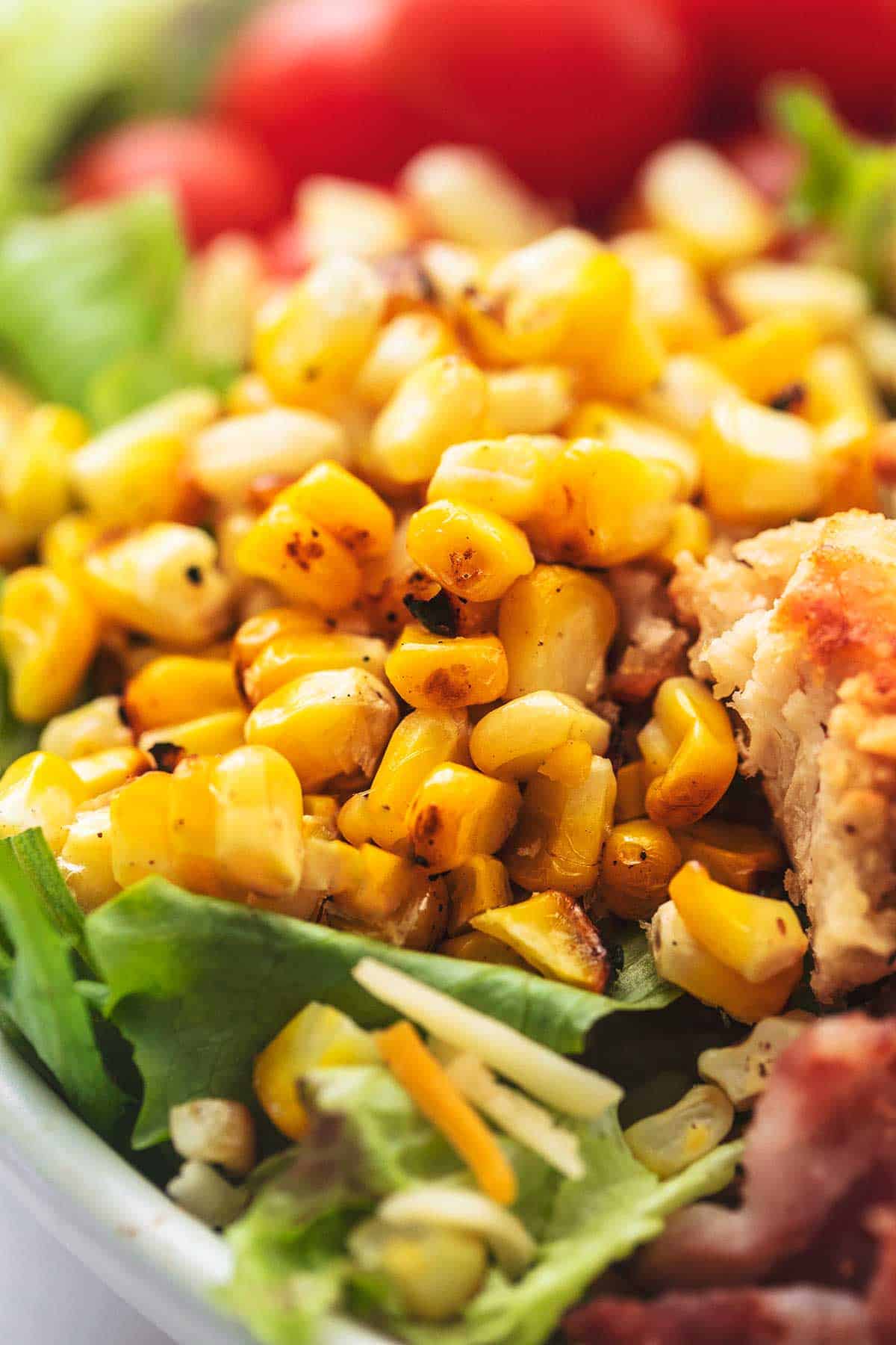 close up of grilled corn from chicken cobb salad.