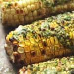 up close grilled corn with herb butter