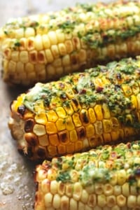 up close grilled corn with herb butter