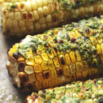 up close grilled corn with herb butter