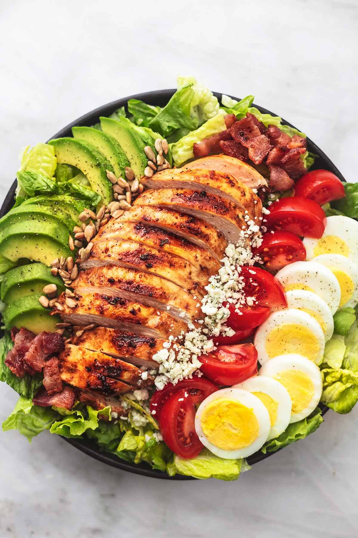 top view of chicken cobb salad in a bowl.