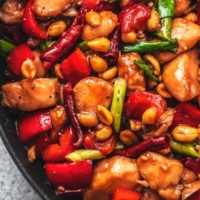 up close kung pao chicken in skillet