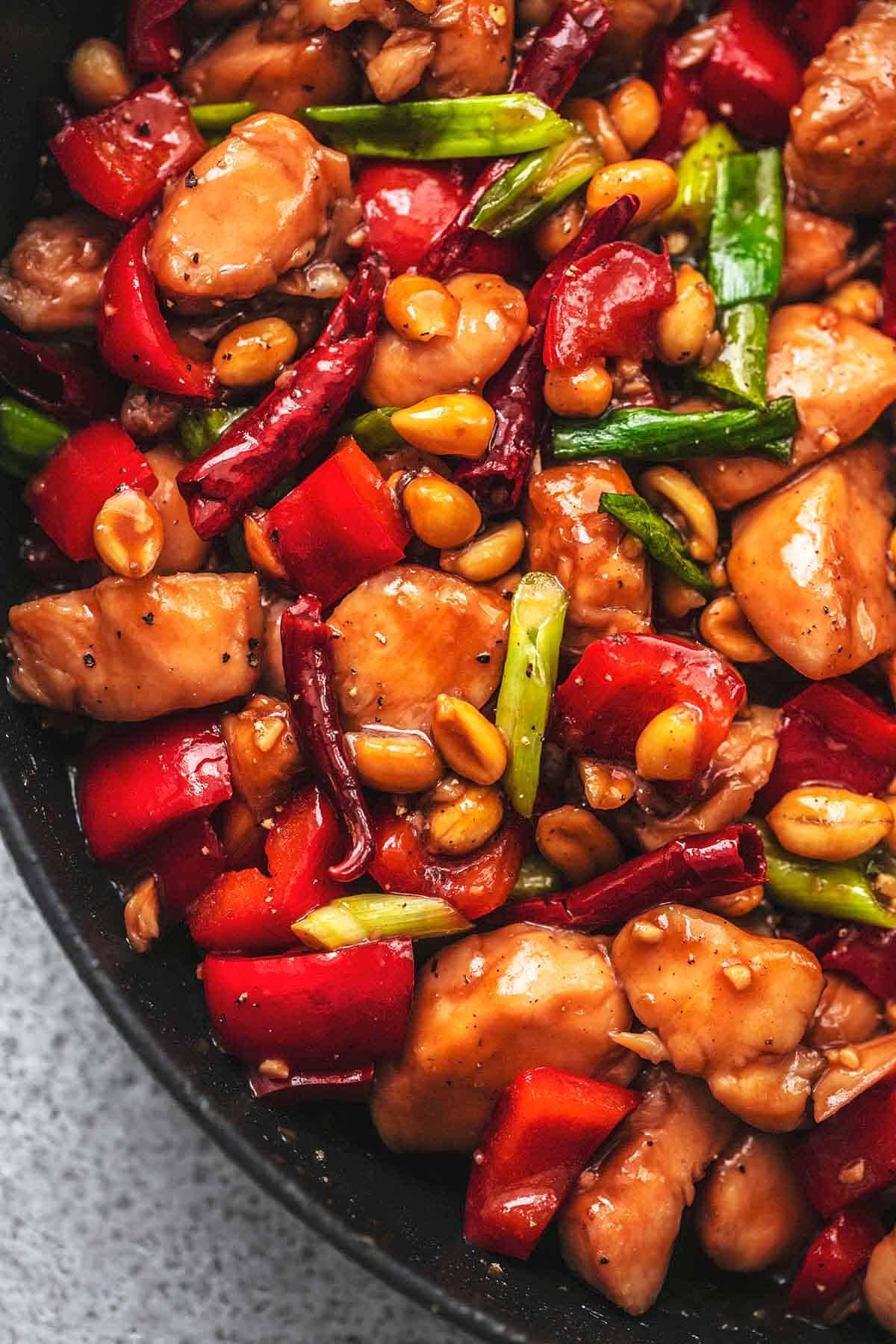 close up of kung pao chicken in a skillet.