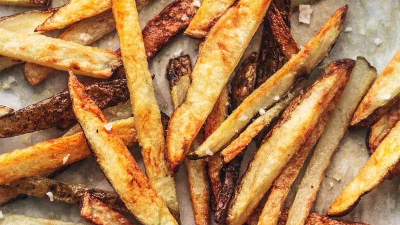 overhead french fries with salt on sheet pan