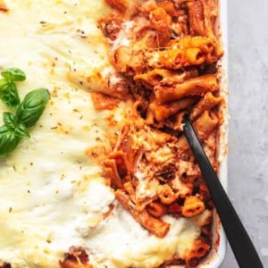 overhead serving spoon dipping into the corner of a pan of pasta