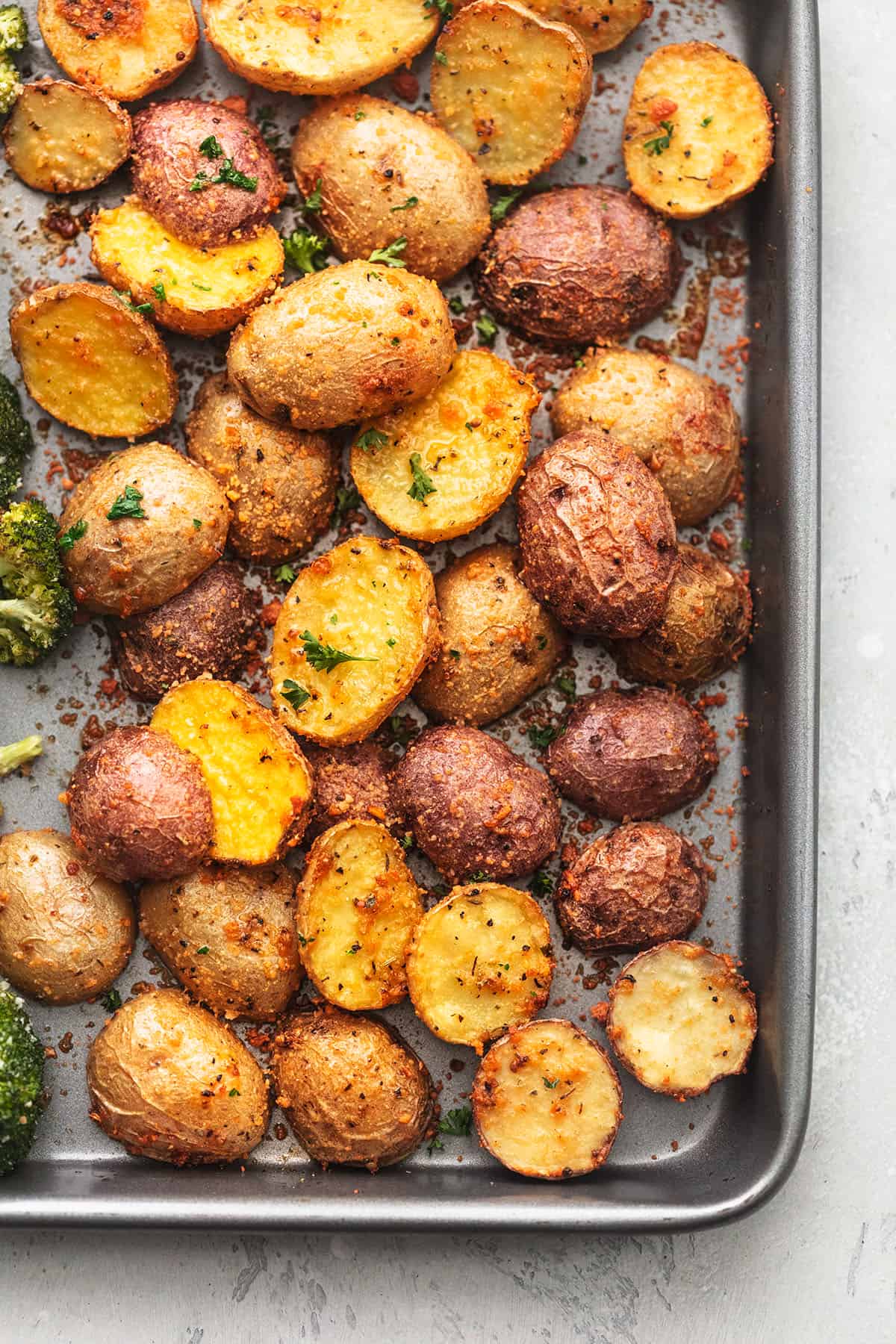 overhead view of the corn of a sheet pan with roasted potatoes