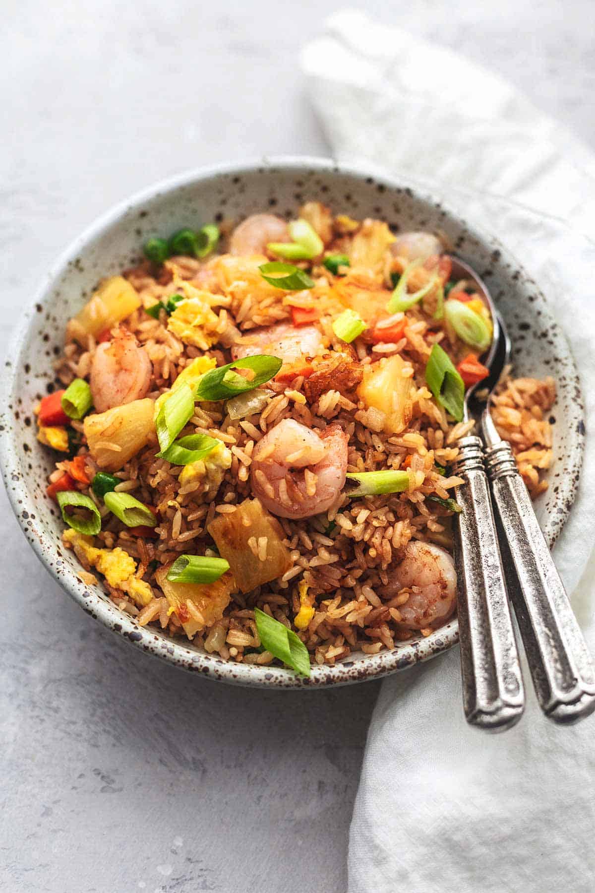 bowl of rice with green onions and shrimp