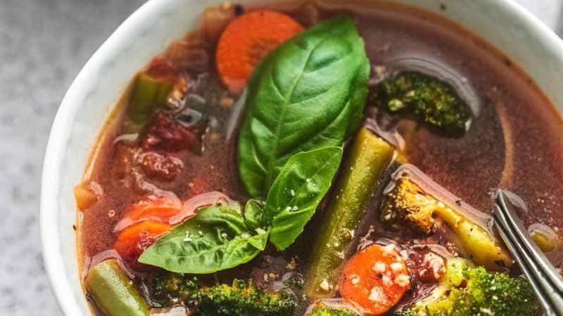 up close three quarter view of vegetable soup in a bowl