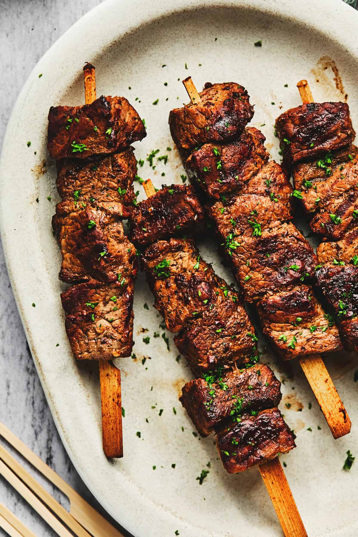 grilled beef kebabs on plate.