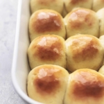 up close dinner rolls in white baking dish