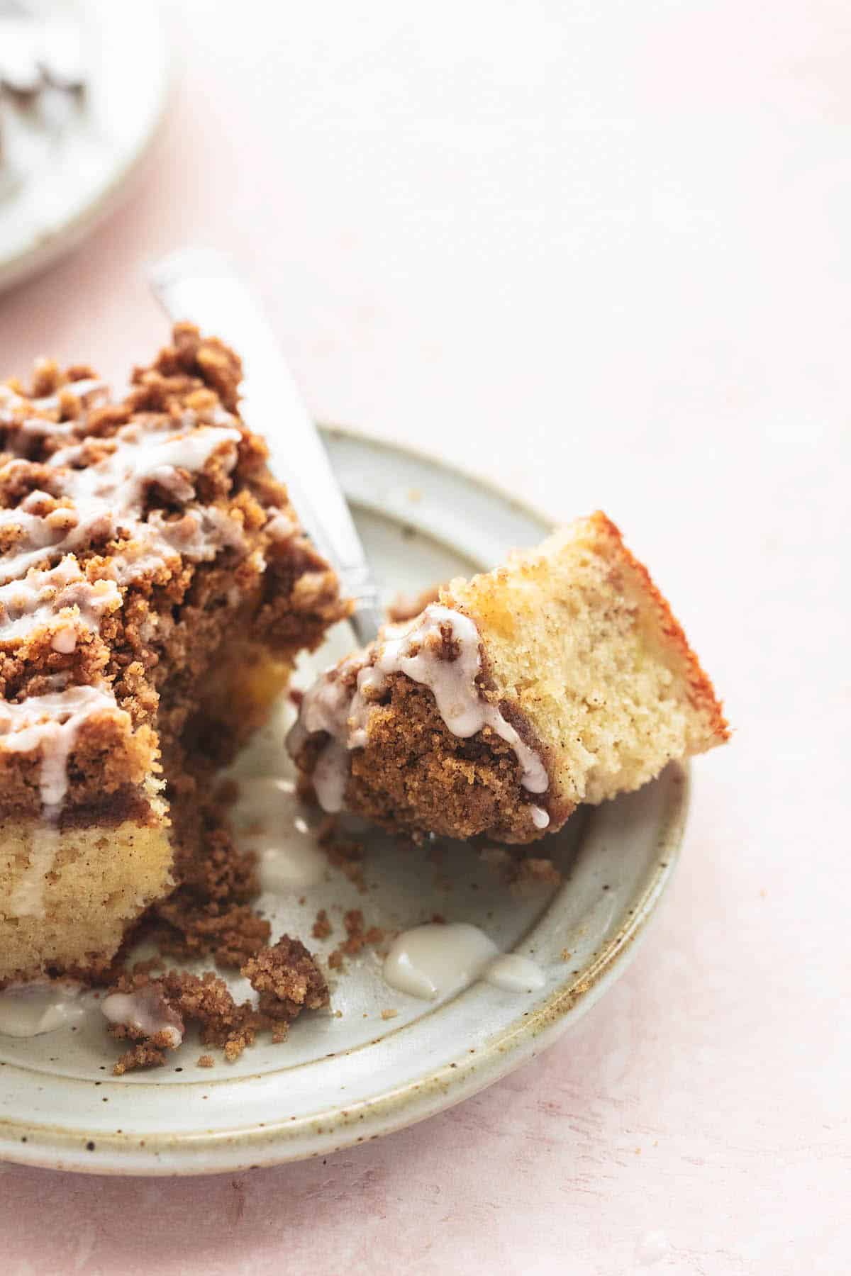 up close bite of crumb cake on a fork