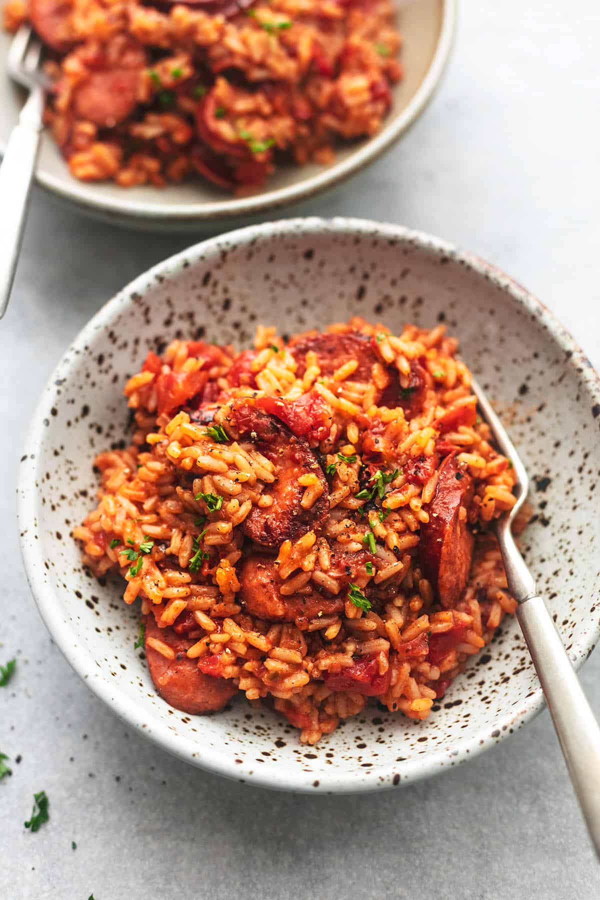 up close rice with sausage and fork in bowl