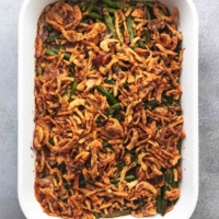 overhead view of green bean casserole in white dish