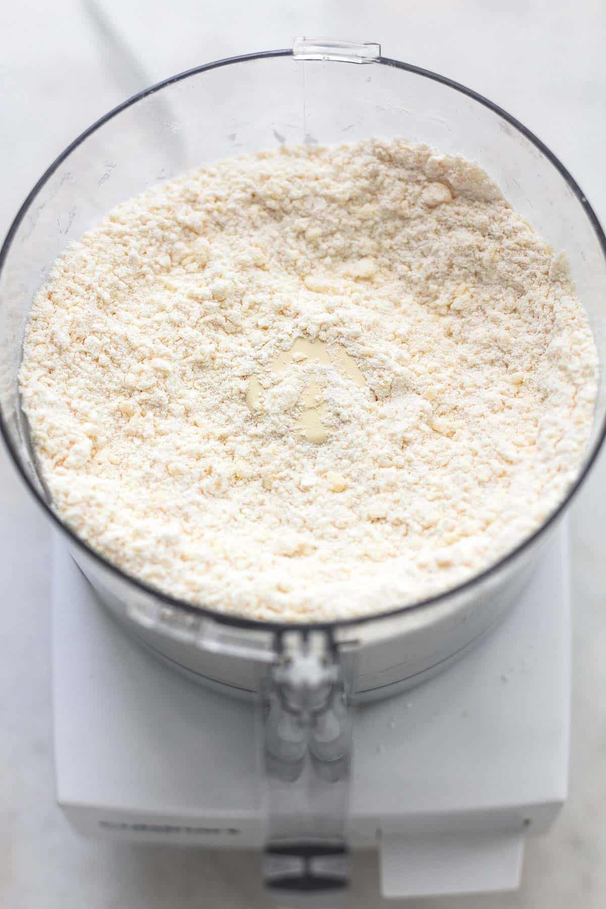 close up of flour mixture in a food processor.
