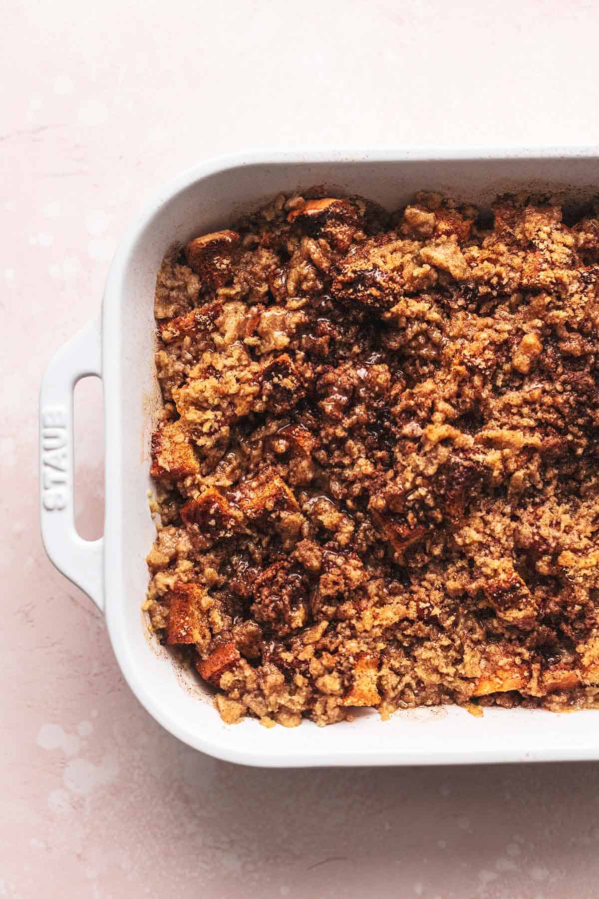 cinnamon streusel topped breakfast casserole in white baking dish