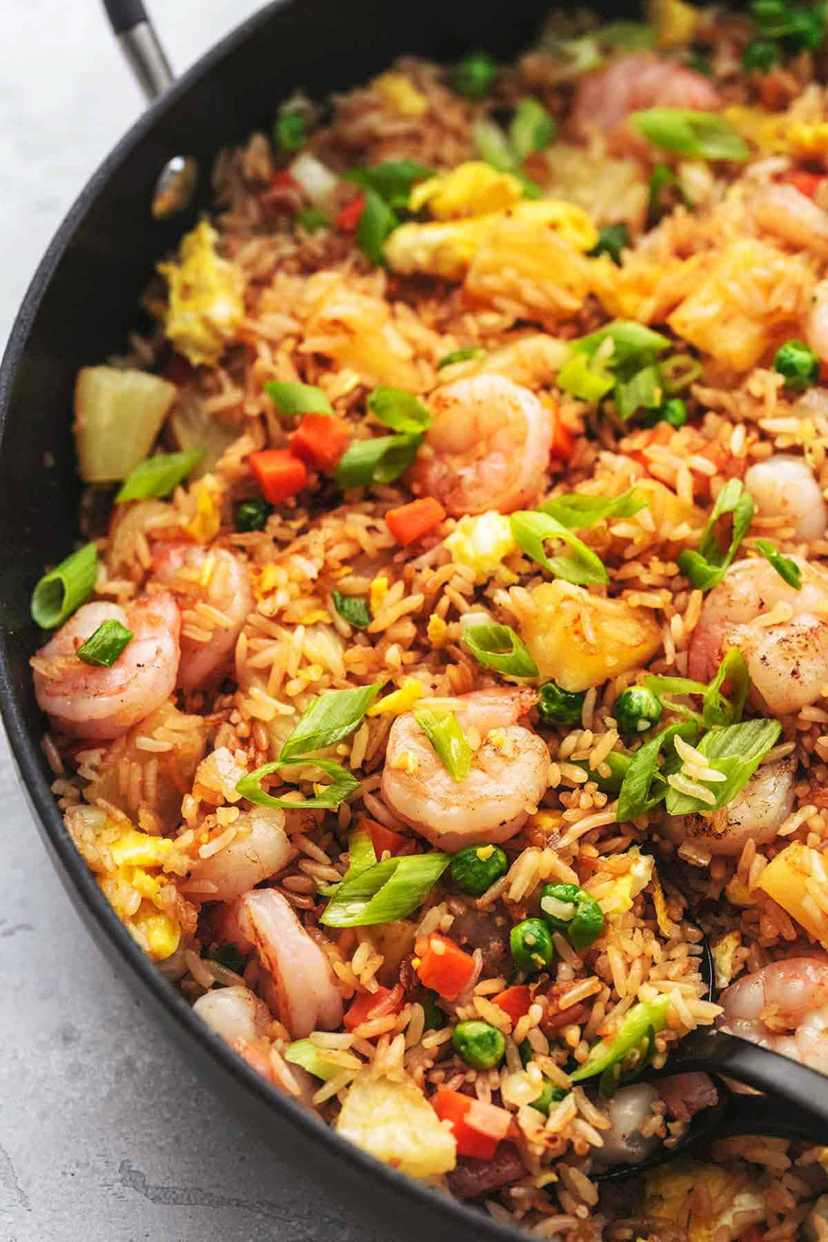 close up of shrimp fried rice in a skillet.