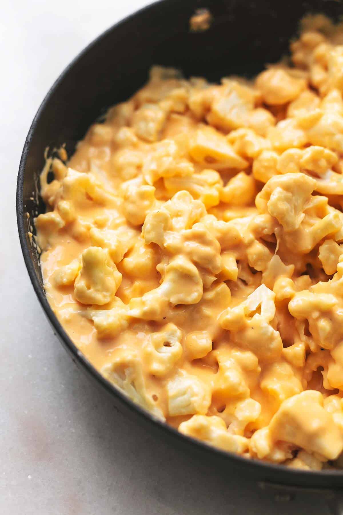 close up of cauliflower mac and cheese in a skillet.