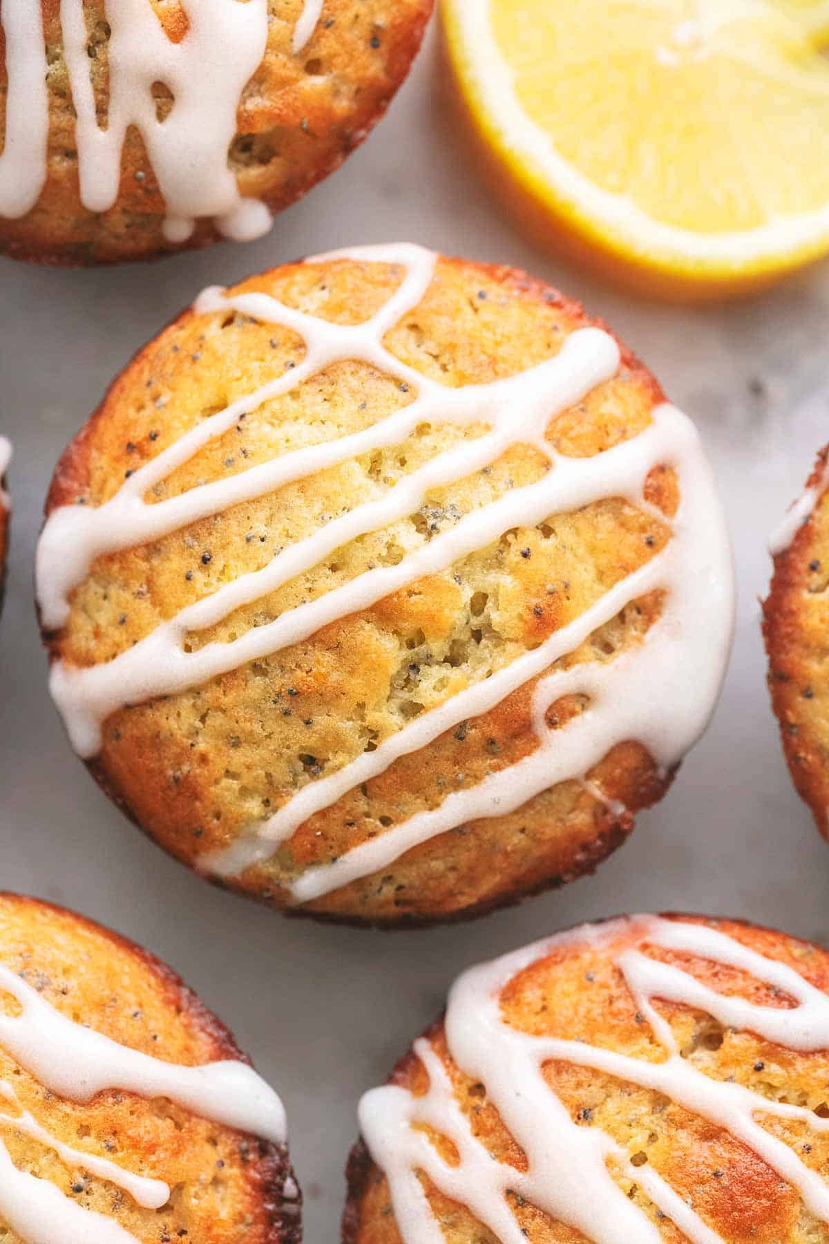 close up top view of lemon poppyseed muffins with glaze on top.