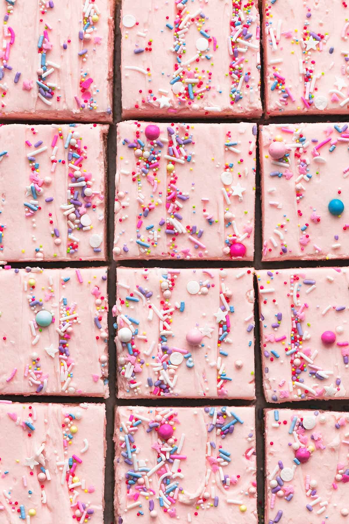 close up top view of sugar cookie bars cut into squares.