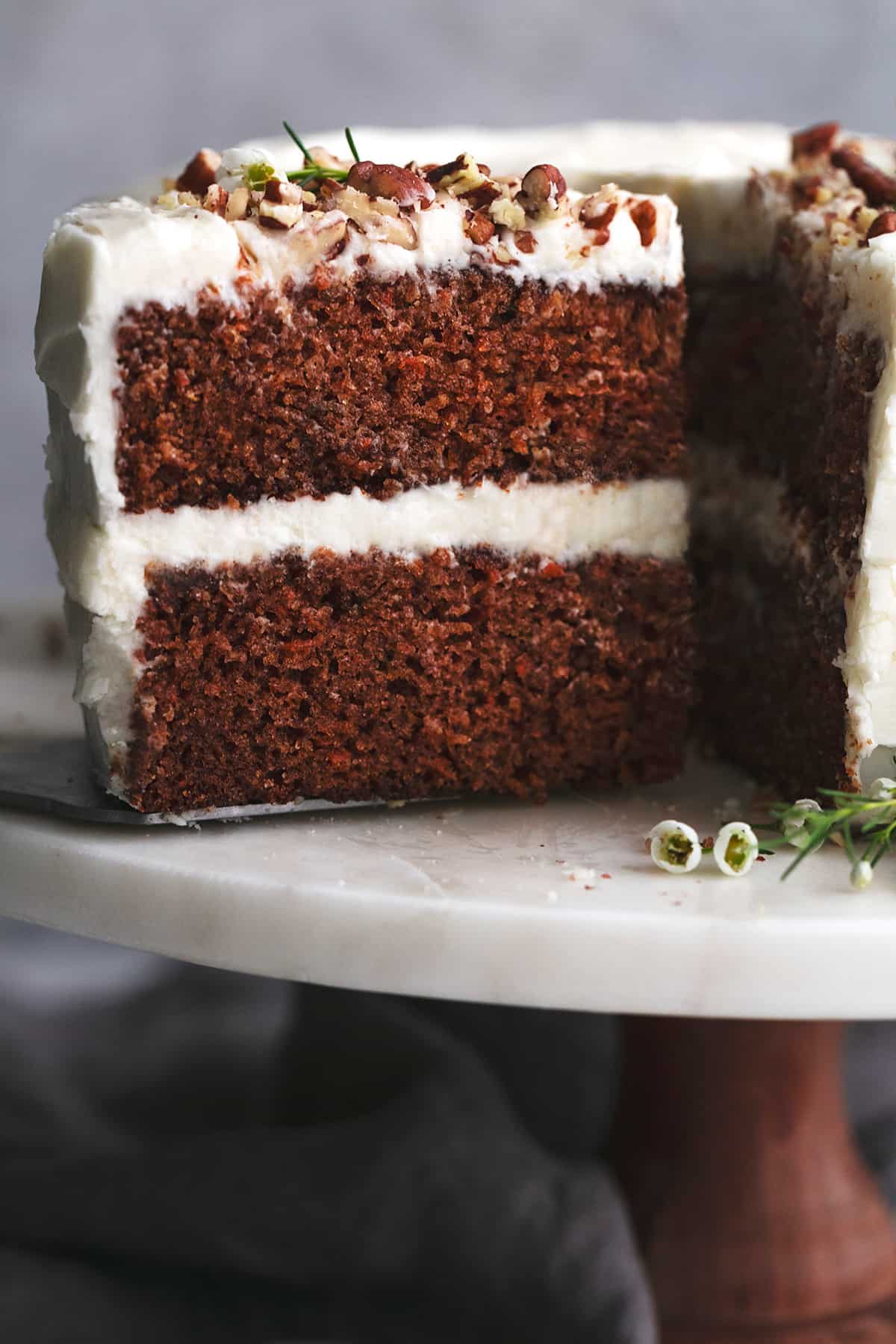 up close slice of cake with two layers on cake stand