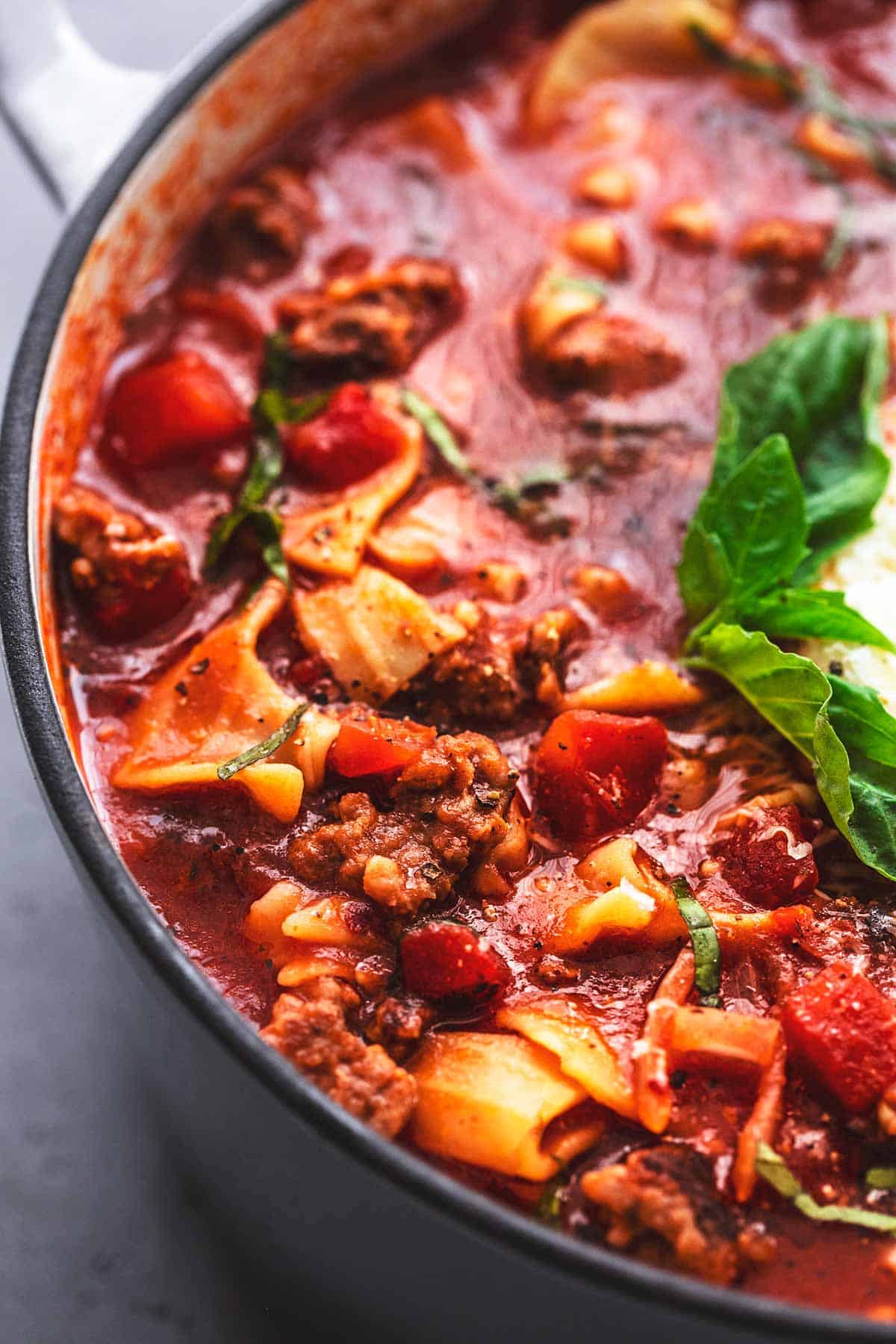 close up of lasagna soup in a pot.