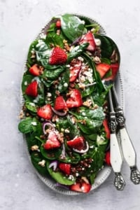 overhead view of strawberry spinach salad with poppy seed dressing