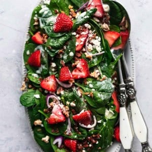 overhead view of strawberry spinach salad with poppy seed dressing