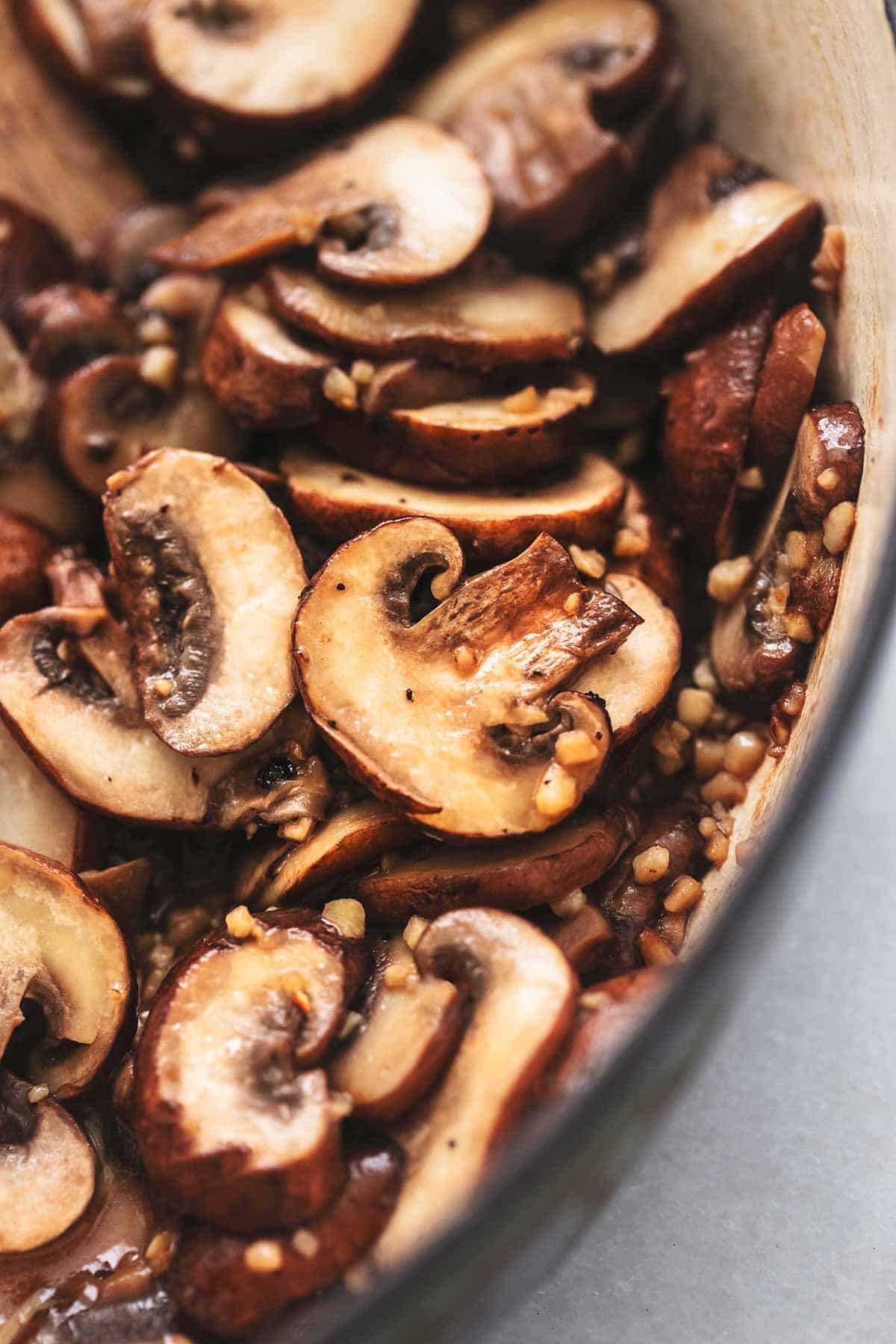 cooked mushroom slices with garlic up close