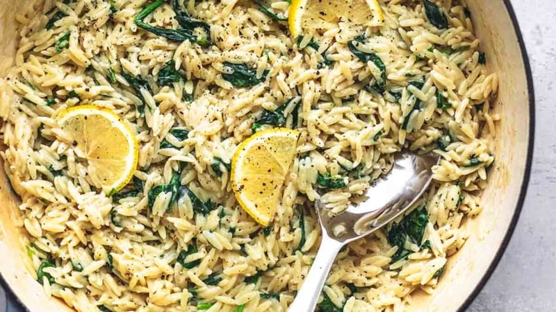 overhead view of pasta and lemons in skillet