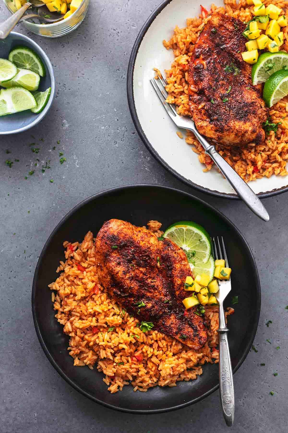 cajun chicken and rice on two plates