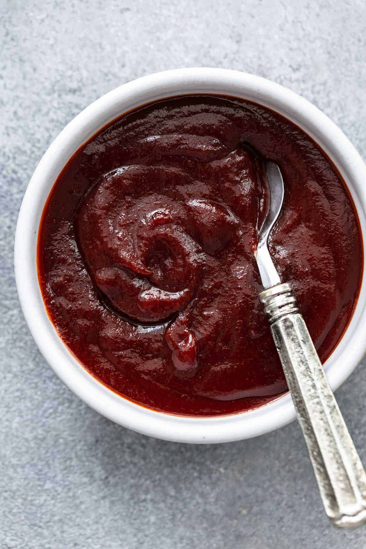 bbq sauce in bowl with spoon