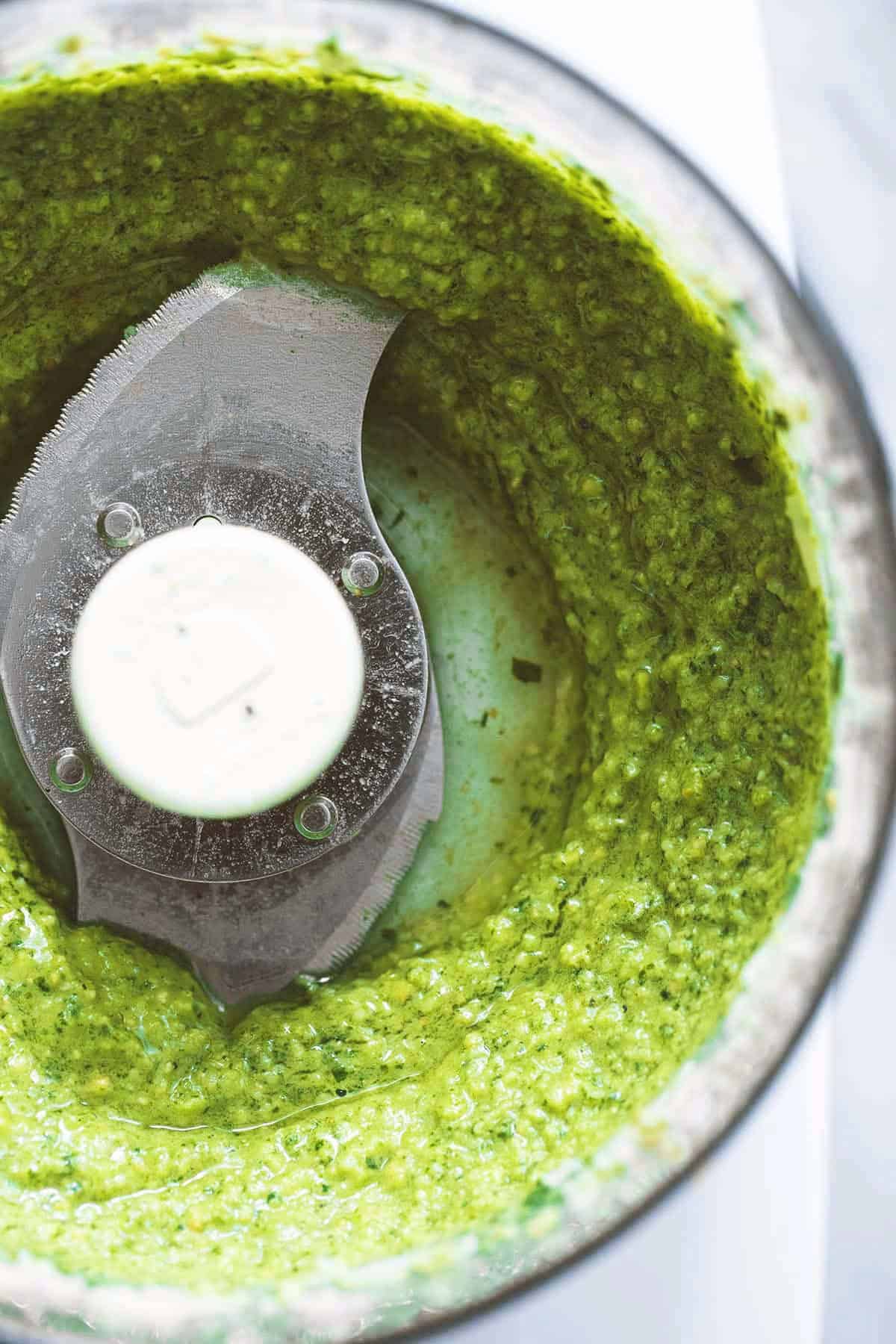 overhead view of pesto sauce in food processor