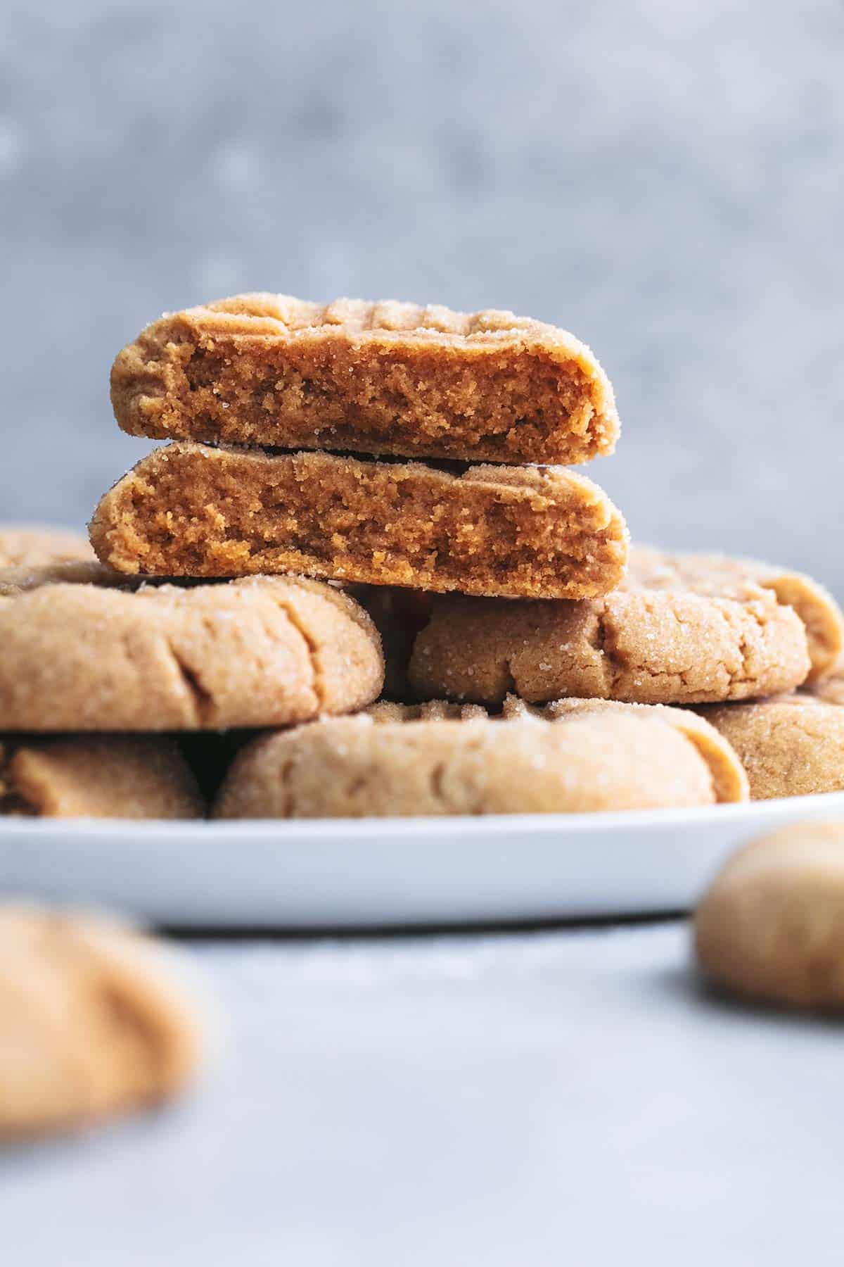 stacked halves of one cookie showing inside of cookie texture on top of more cookies