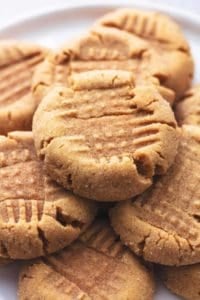 stacked peanut butter cookies on plate