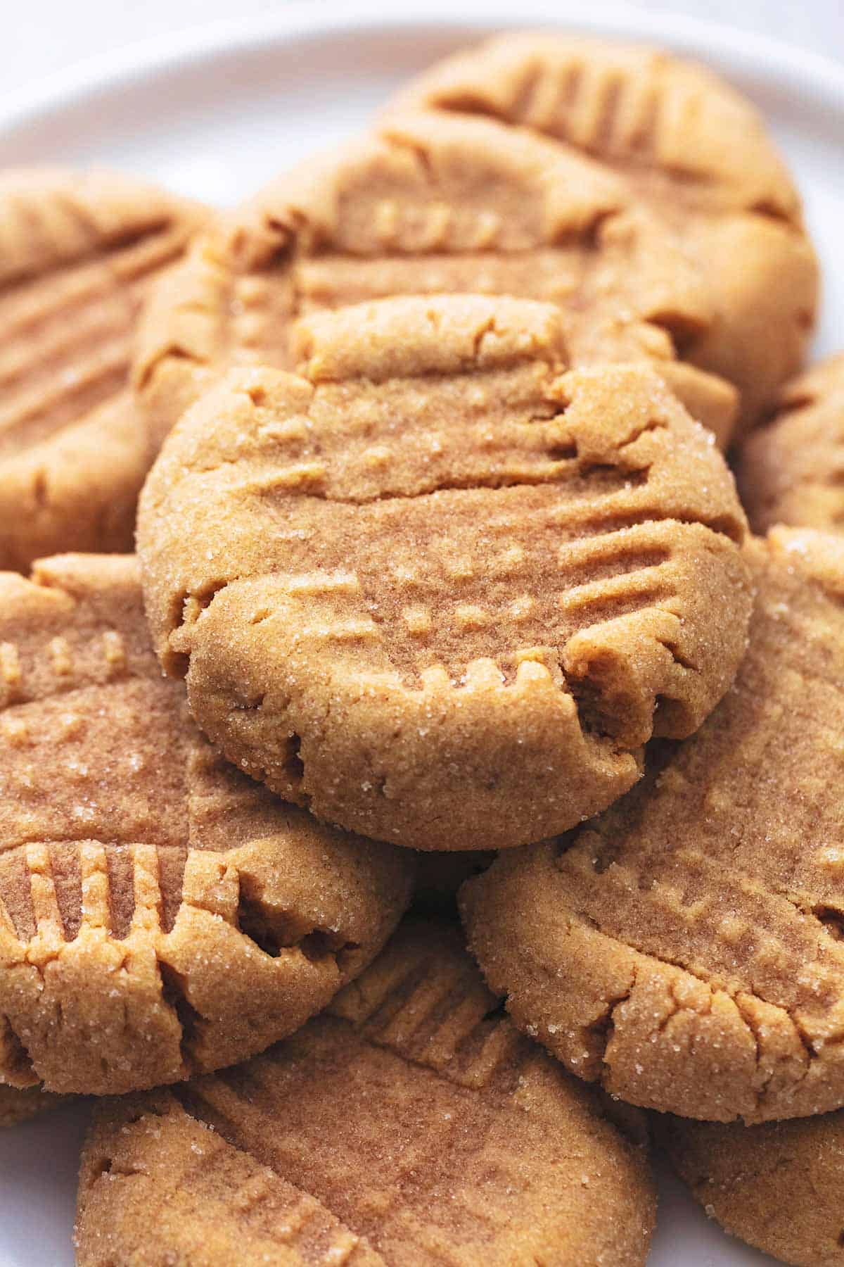 stacked peanut butter cookies on plate