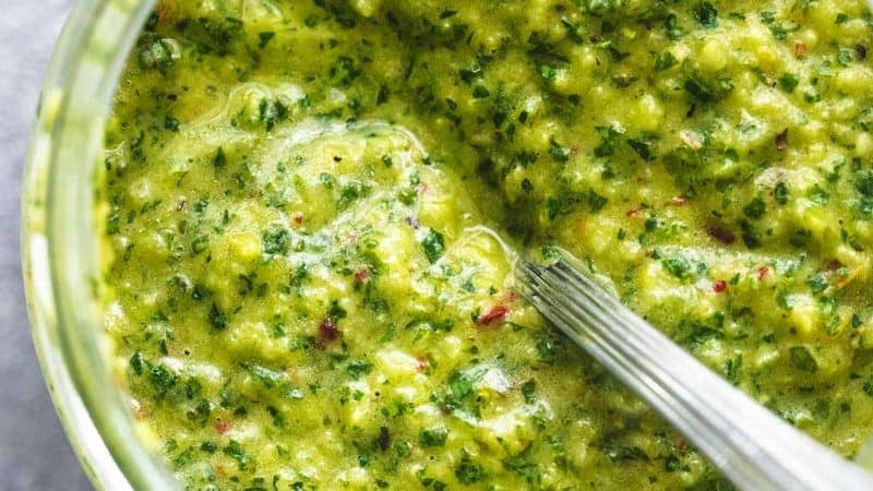 chimichurri sauce in bowl with spoon