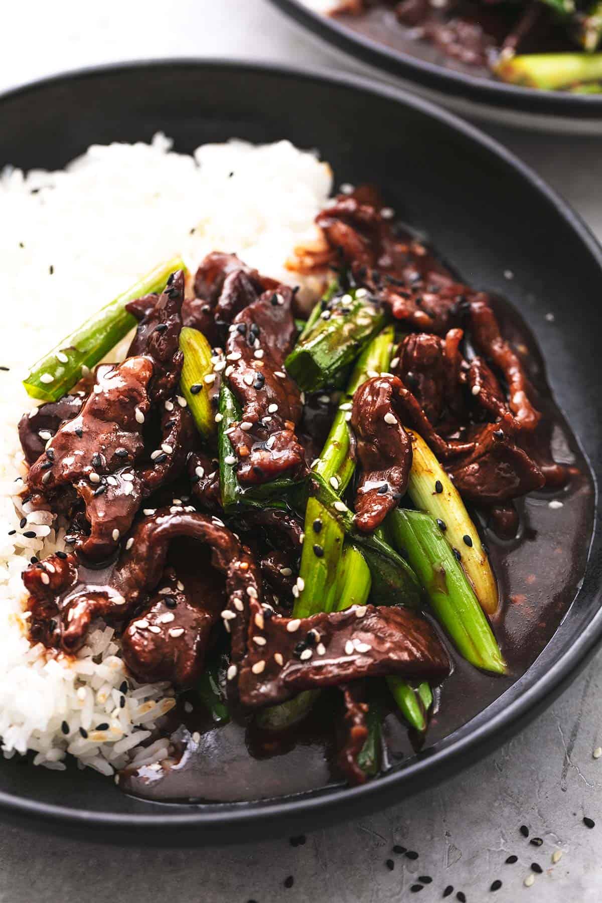 up close beef and green onions in sauce