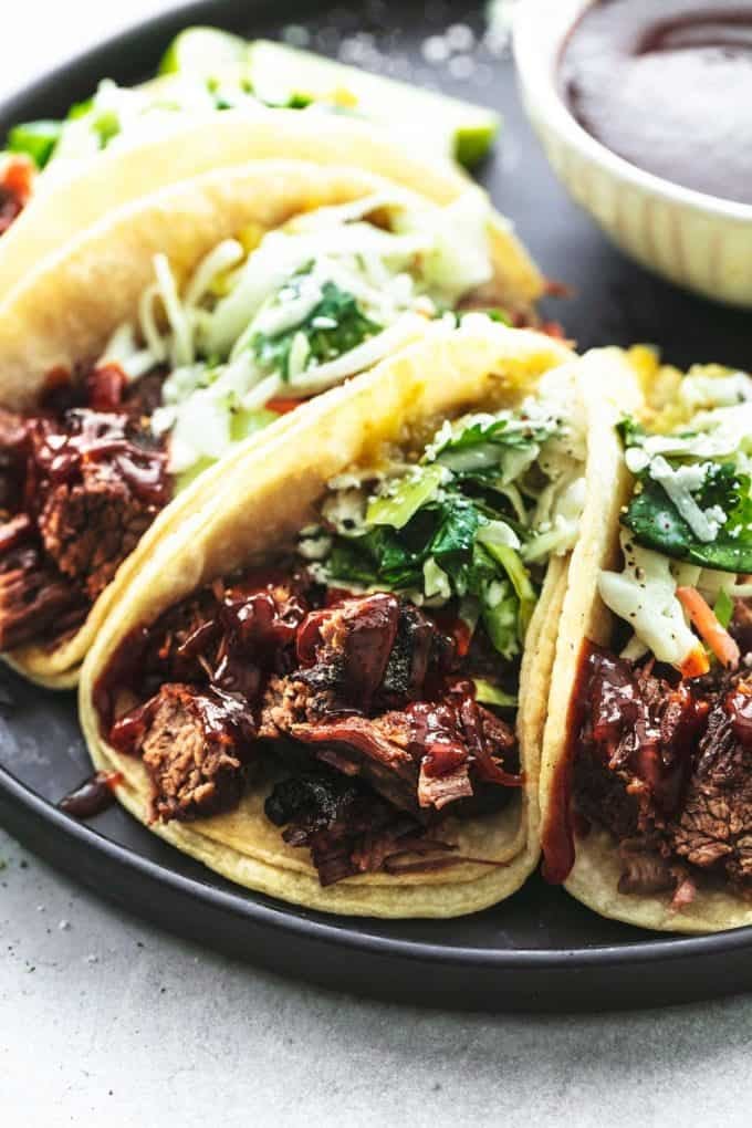 up close beef brisket in tortillas with slaw