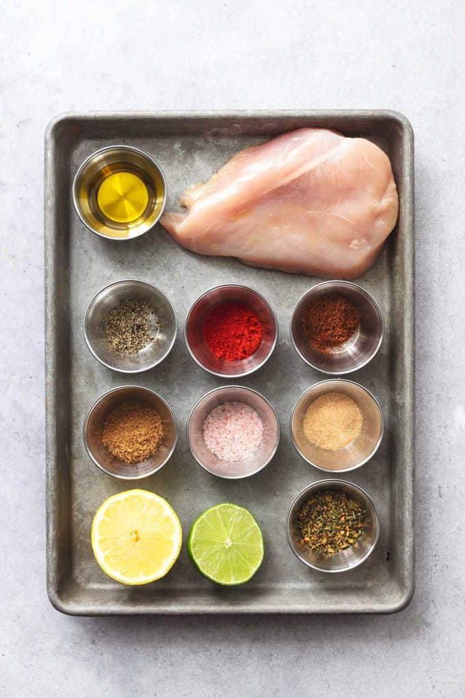 baking sheet with ingredients for baked chicken