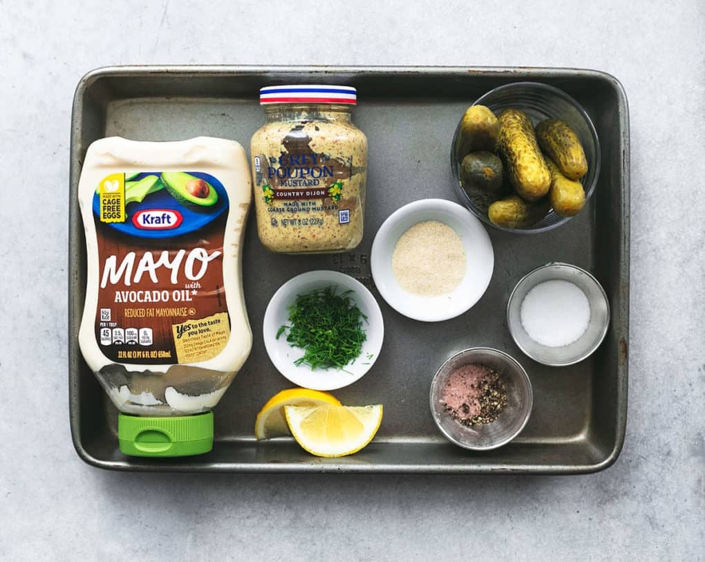 ingredients for tartar sauce on a sheet pan