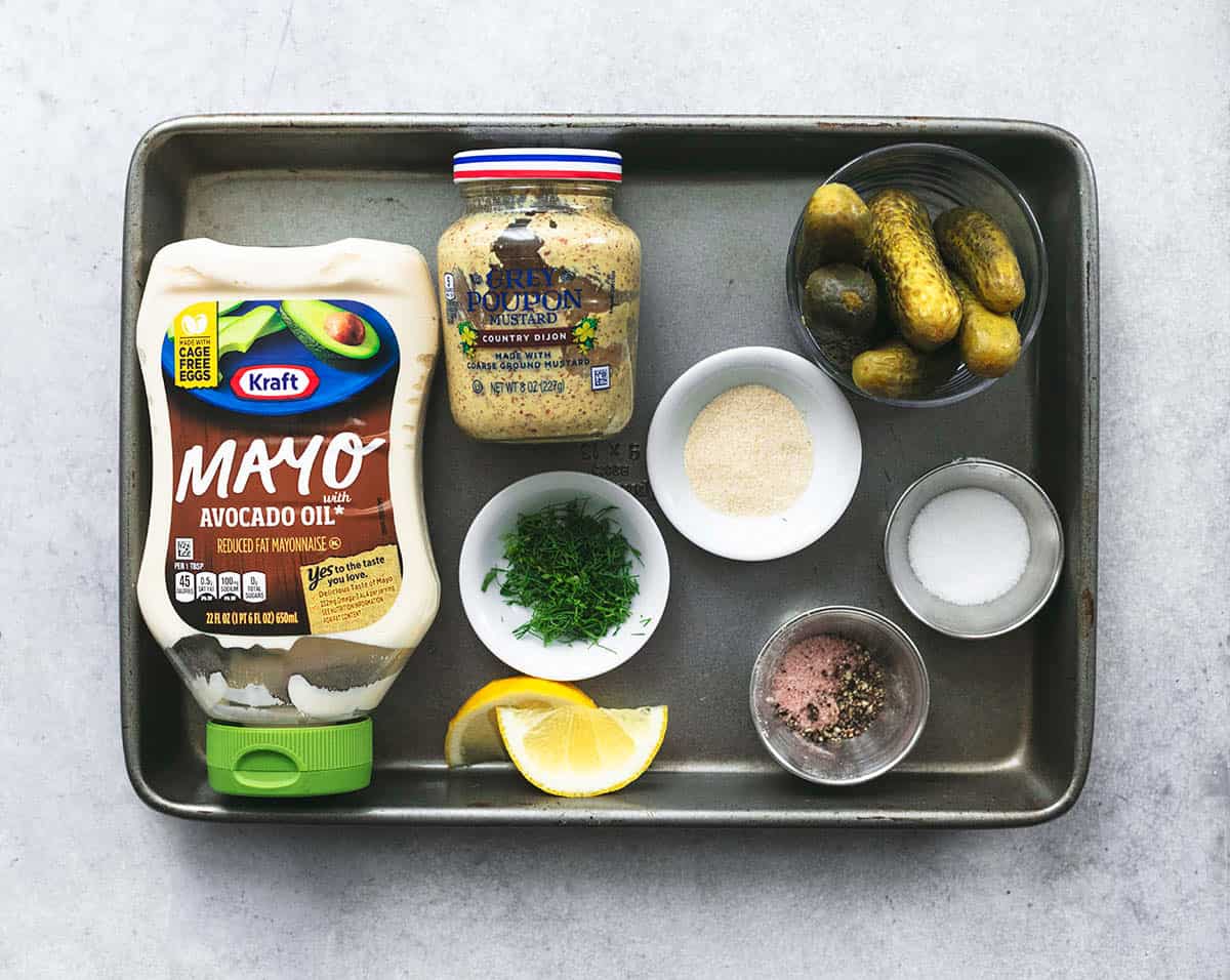 ingredients for tartar sauce on a sheet pan