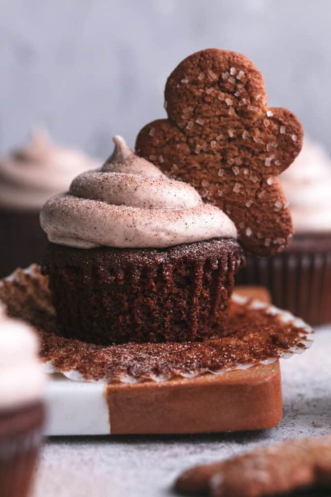 unwrapped cupcake with frosting and gingerbread man decoration