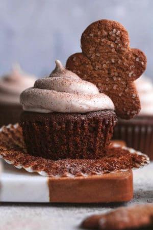 cupcake with cinnamon frosting and gingerbread man cupcake topper