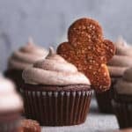 gingerbread cupcake with frosting and gingerbread man topper
