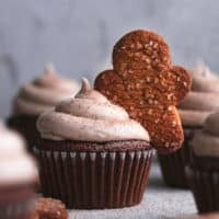 gingerbread cupcake with frosting and gingerbread man topper