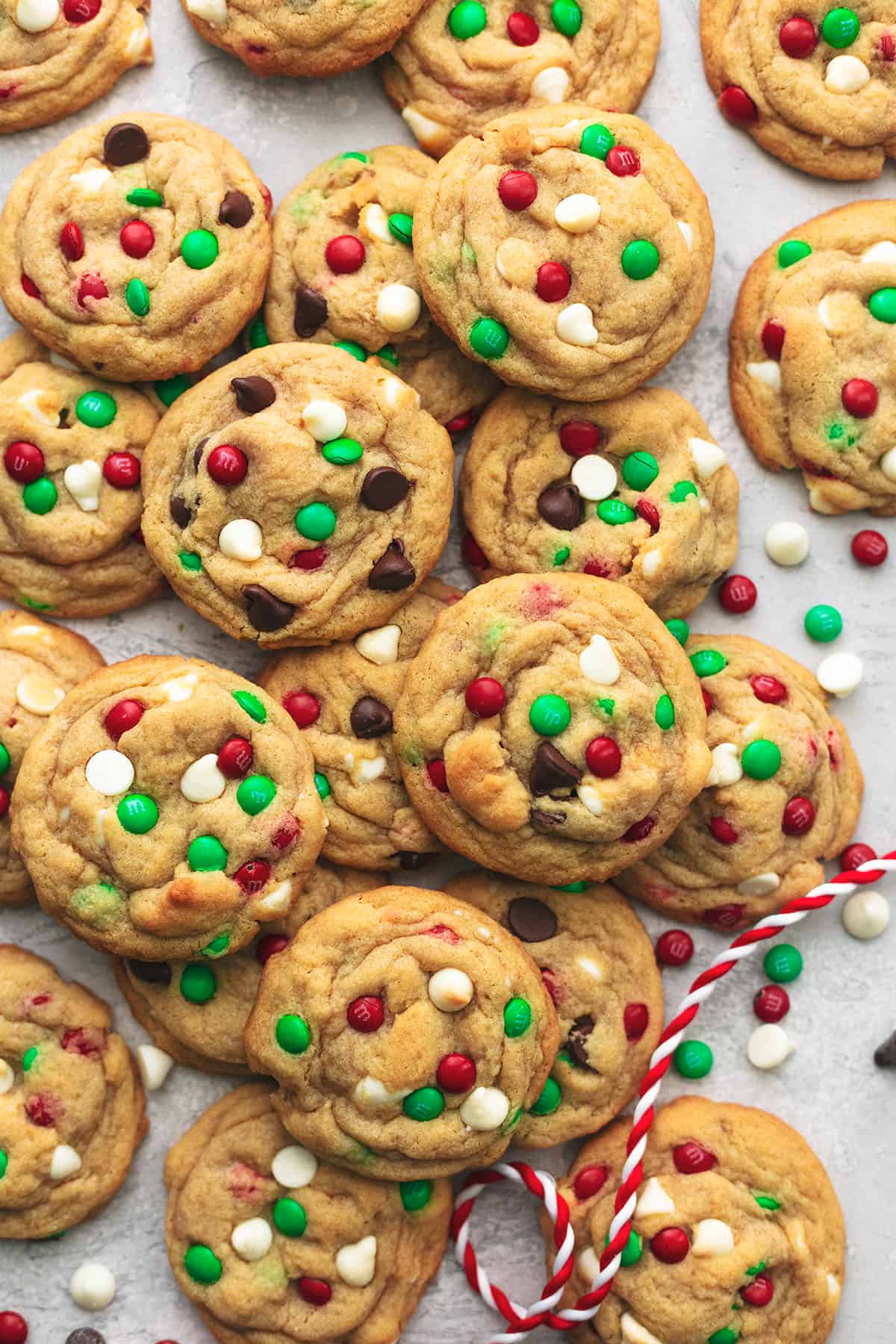 cookies with red and green candies and chocolate chips on table